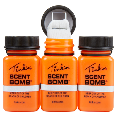 three bottles, centre one open with wick - W5841